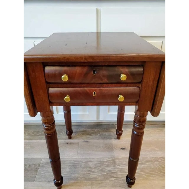 A late Federal period mahogany work table, finished in elegant and refined Sheraton taste, dating to early/mid 19th...