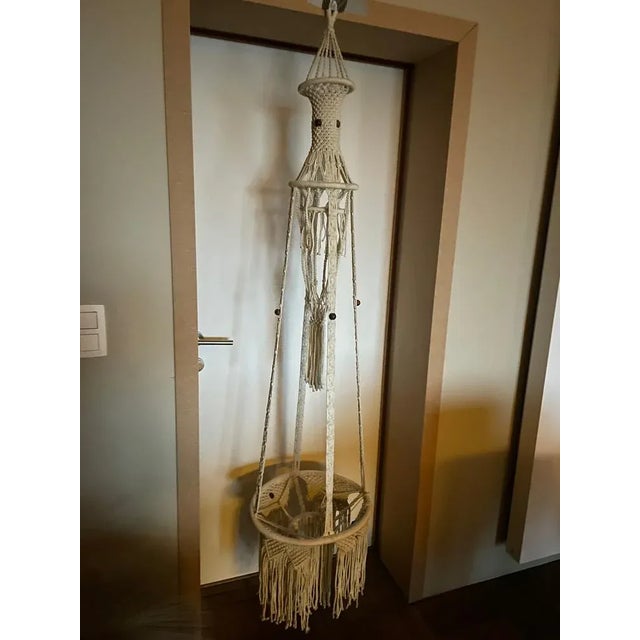 We can add 2 containers in the rope, a small above and a larger below for plants or other