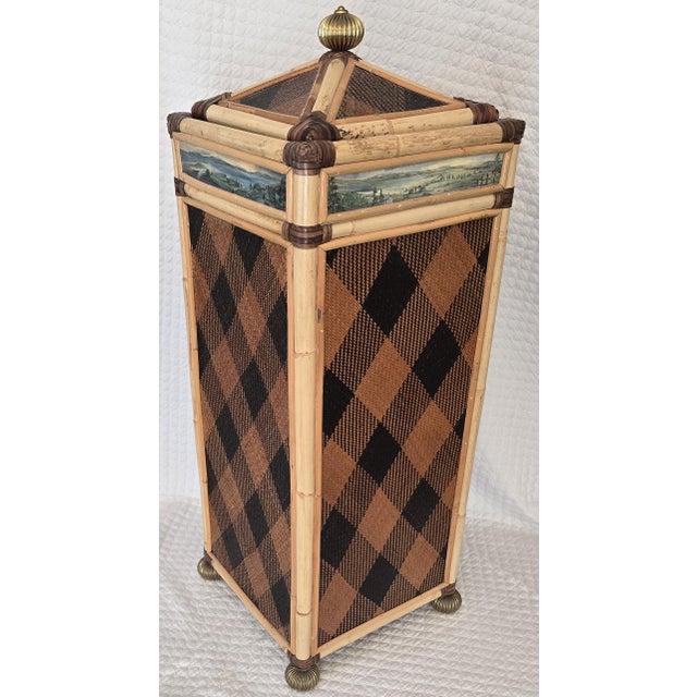 Decorative bamboo and rattan wastebasket by MacKenzie-Childs, crafted in the United States. The piece features hand-...