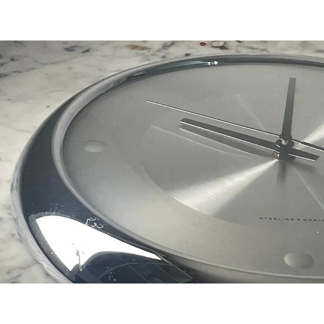 Crafted from gleaming stainless steel and chrome, the minimalist design of this Sterling & Noble clock makes it a striking...