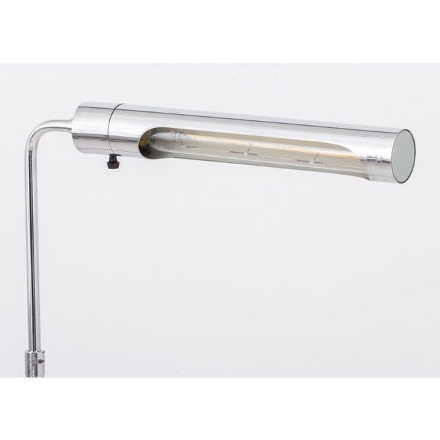 Mid-Century Modern Chrome Adjustable Floor Lamp, the cylindrical light on swivel arm and round base. Tallest form: 48" H x...