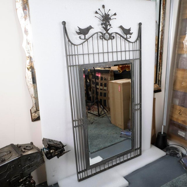 Wrought iron mirror with bird and flower motif