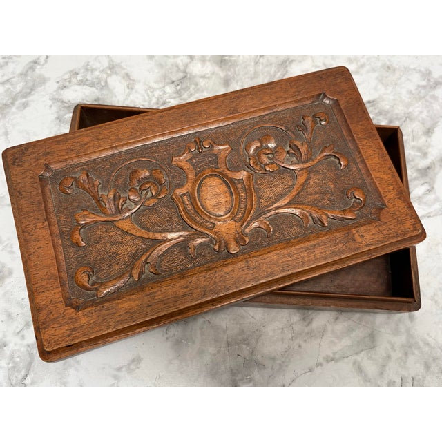 Vintage solid wood carved wooden box for jewelry or trinkets. Androgynous for men or women with a carved crest on the...