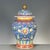 A richly decorated Chinese famille rose porcelain covered jar in the classic "General's jar" form. The royal blue ground...
