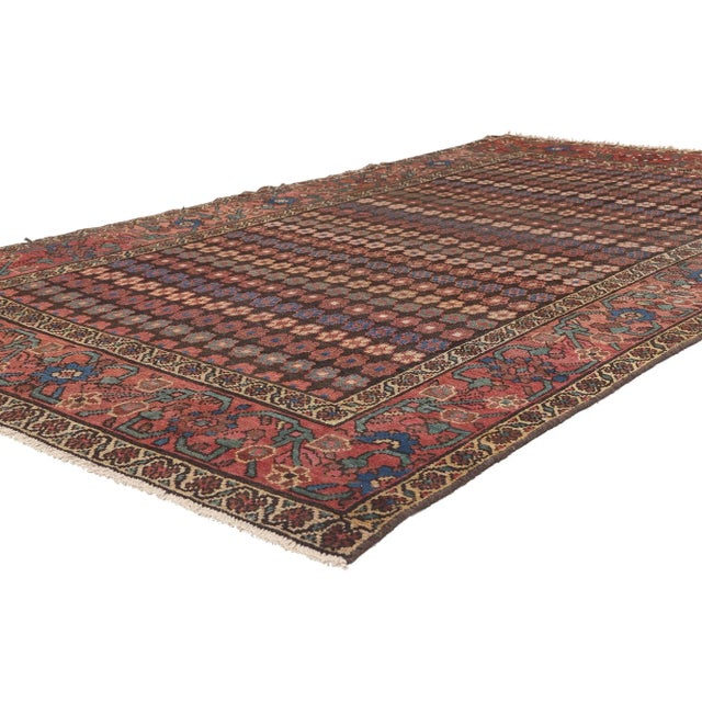 75253 Antique Persian Hamadan Rug, 04’10 x 08’09. Earth-tone elegance meets flower power in this antique Persian Hamadan...