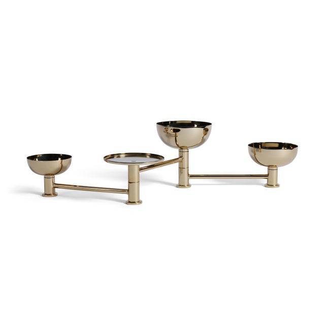 Elevate your entertaining with this sleek swivel condiment set, crafted from polished stainless steel with warm brass...
