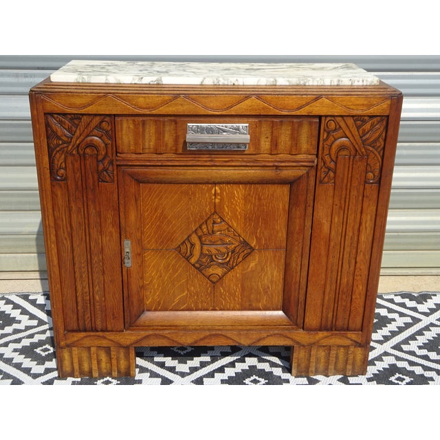 Vintage furniture, a sideboard made in France in the 1930s. The frame is solid oak; the cupboard door is veneered. It...