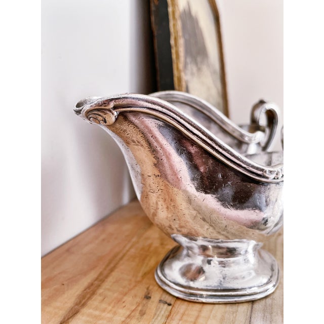 A pair of antique circa 1920s heavy silver plated sauce or gravy boats from The St Francis Hotel in San Fransisco. In...