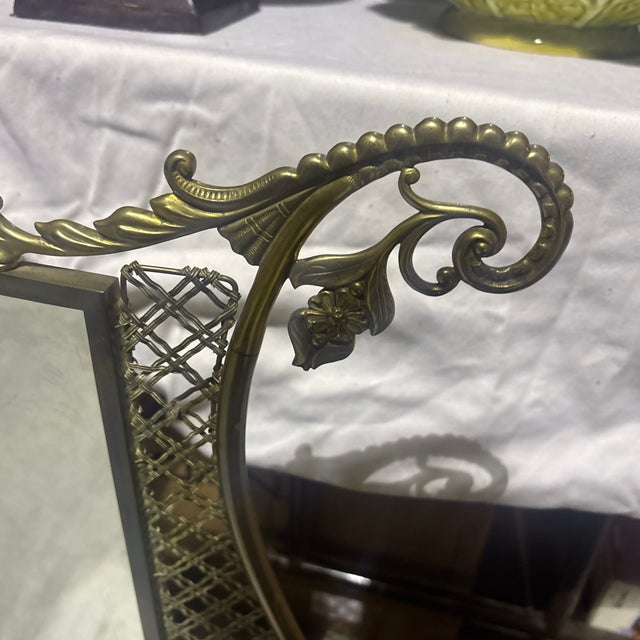 Beautiful brass mirror with claw feet.