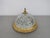 An elegant Vintage French ceiling lamp featuring a domed crystal glass shade with a striking geometric cut pattern,...