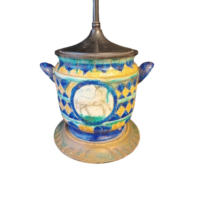 Vintage Italian table lamp in the style of Bitossi. Lamp is made from a piece of handled pottery set upon a guided wooden...