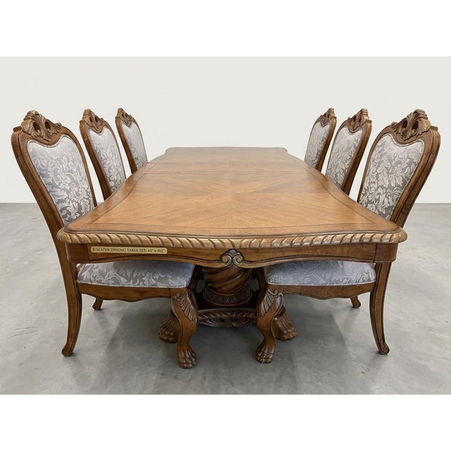 Bring old-world elegance and warmth to your home with this stunning 8-seater dining room set. Perfect for holiday hosting...