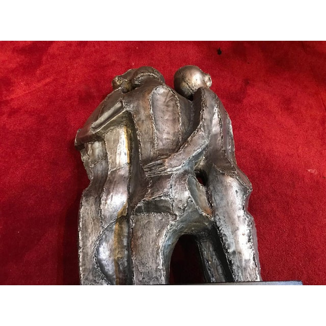 Three Mid century brutalist man of pottery pliable 70’sin perfect condition mounted on a block of wood 19” inches tall by...