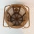 A beautifully textured vintage rattan basket featuring double swing handles and intricate geometric woven panels. The...