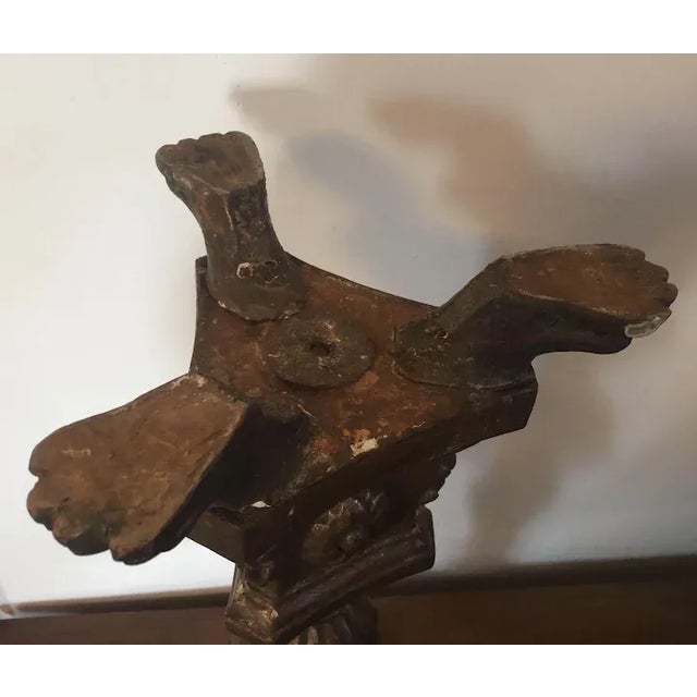 Antique 18th c. Continental carved and gilt wood Baroque altar candle stick. Urn form stem supports a round plateau for a...