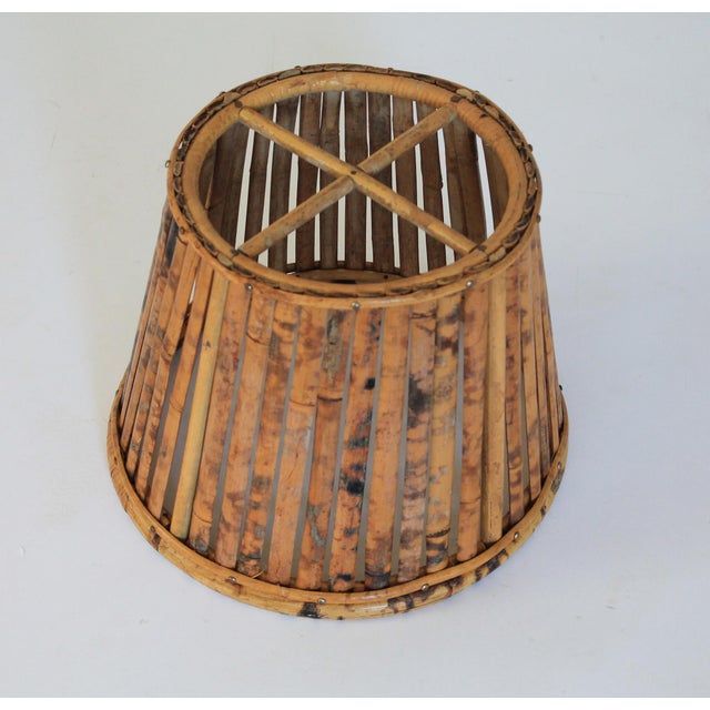 Vintage lamp shade made of bamboo. No makers mark. Minor age wear. Top 9.5"diam Bottom 13"diam Height 10"