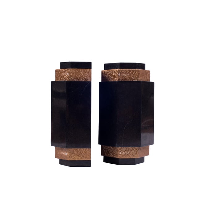 With their octagonal shape and the use of black stone and gold shagreen effect leather, these bookends were inspired by...