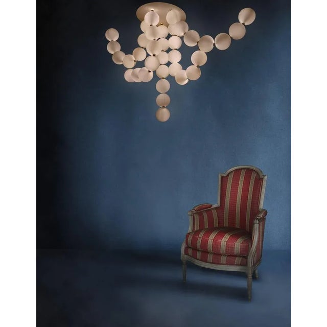 Pearl necklace pendant, Ludovic Clément d’Armont. Material: blown glass and brass. Dimensions: glass diam 12 cm. H 120...