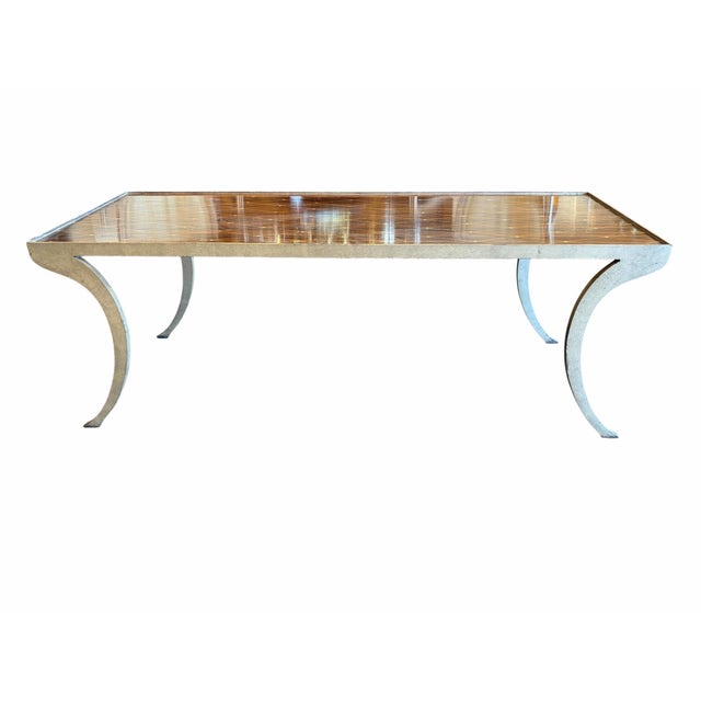 Bring an understated touch of haute-couture luxury into your living space with this striking Rateau Coffee Table by the...