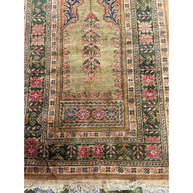 Nice vintage Turkish Kayseri rug with a beautiful mihrab design and nice colours with a green field with blue, orange and...