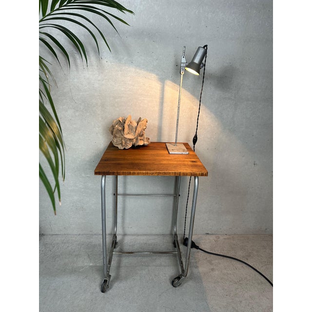 Industrial mobile writing desk. Ideal as a side table. Beautiful patina. Height: 68.5 cm. Tabletop: 45 cm x 45 cm x 2 cm....