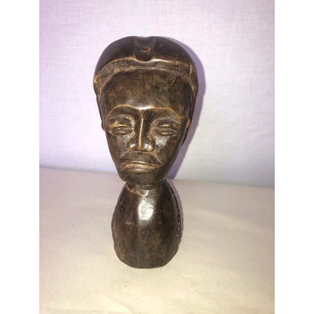 Vintage hand carved wooden African figure. Perfect addition to any space and for the interior designer.