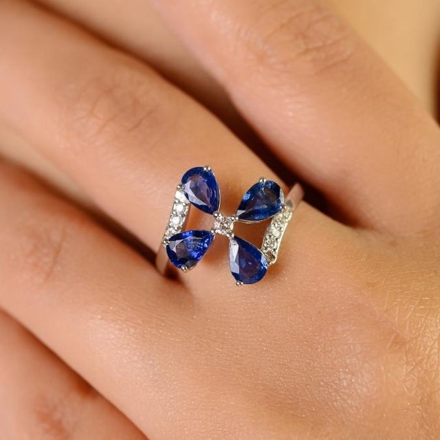 This elegant ring features 4 pear-cut blue sapphire totaling 1.58 carats, set in 14K white gold. Each gemstone measures...