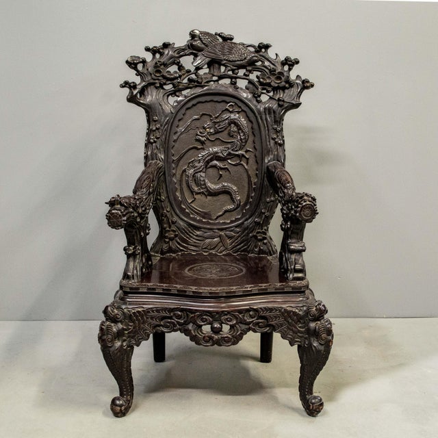 Antique exquisitely carved Japanese high back, dark red (looks almost black) lacquer arm chair featuring dragon head arm...