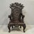 Antique exquisitely carved Japanese high back, dark red (looks almost black) lacquer arm chair featuring dragon head arm...