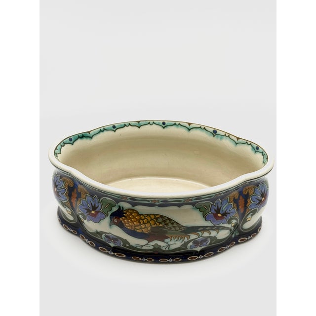 A rare and finely executed Art Nouveau jardinière by Rozenburg Den Haag, dating to circa 1910. This hand-painted faience...