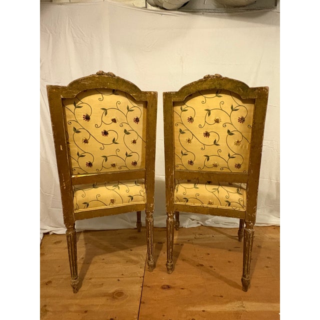 This is a stunning pair of 19th Century antique Louis XVI gilt side chairs has its all-original finish. Incredible carved...