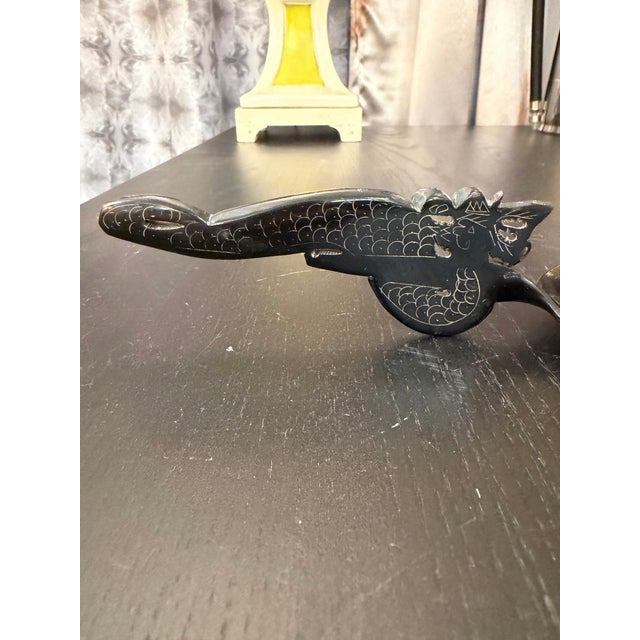Hand carved horn spoon. The handle is delicately carved and part of the entire spoon--one piece of horn. It is also...