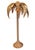 Bring an iconic tropical allure into your space with this sculpted rattan palm tree floor lamp. Crafted in the bold style...