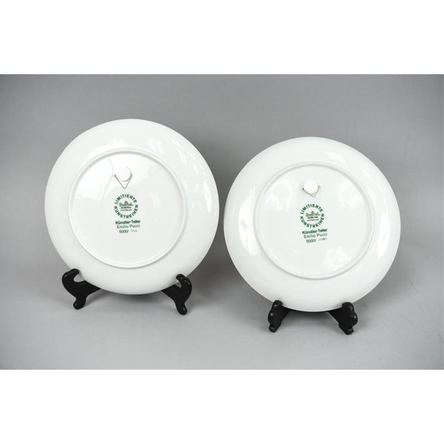 A pair of porcelain plates designed by Emilio Pucci in the 1960's. The brightly glazed geometric design features the...