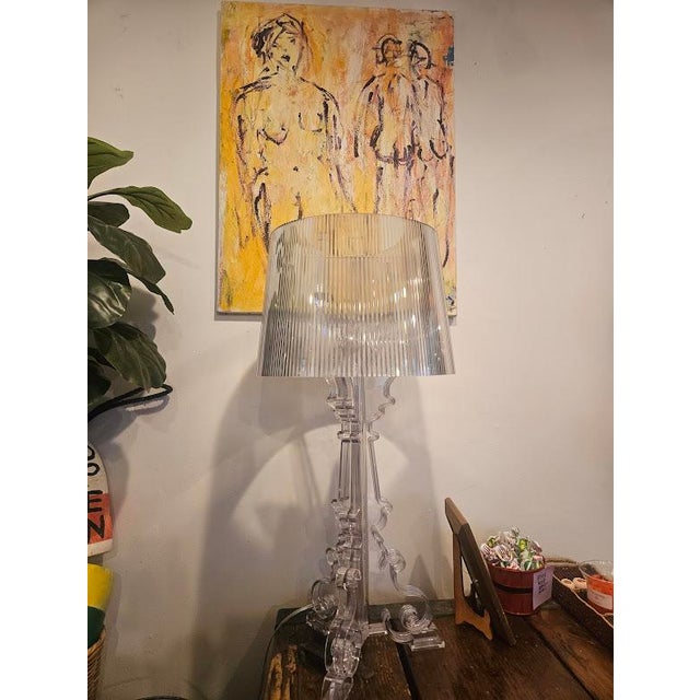 This lamp was designed by Ferruccio Laviani for Kartell. It's made of transparent polycarbonate and has a dimmable...