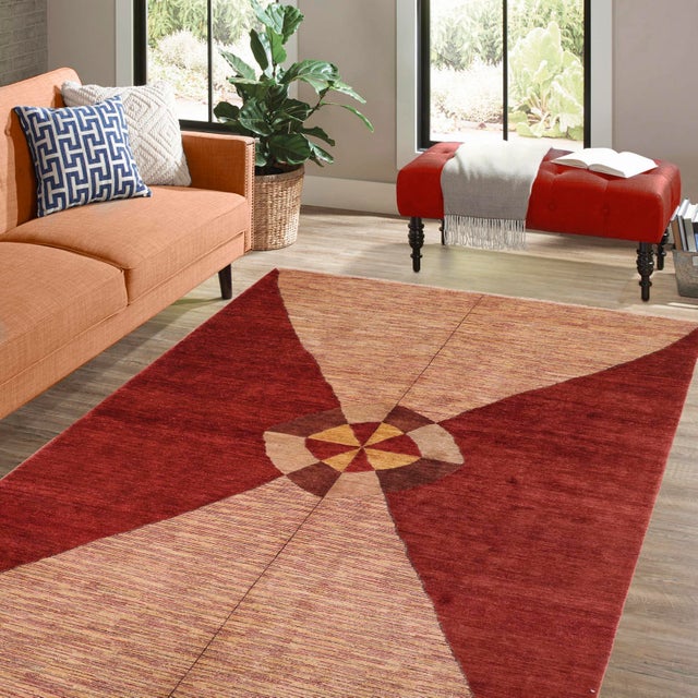 Transform your home's interior with a stunning hand-knotted Gabbeh rug. These rugs are meticulously crafted with bold...