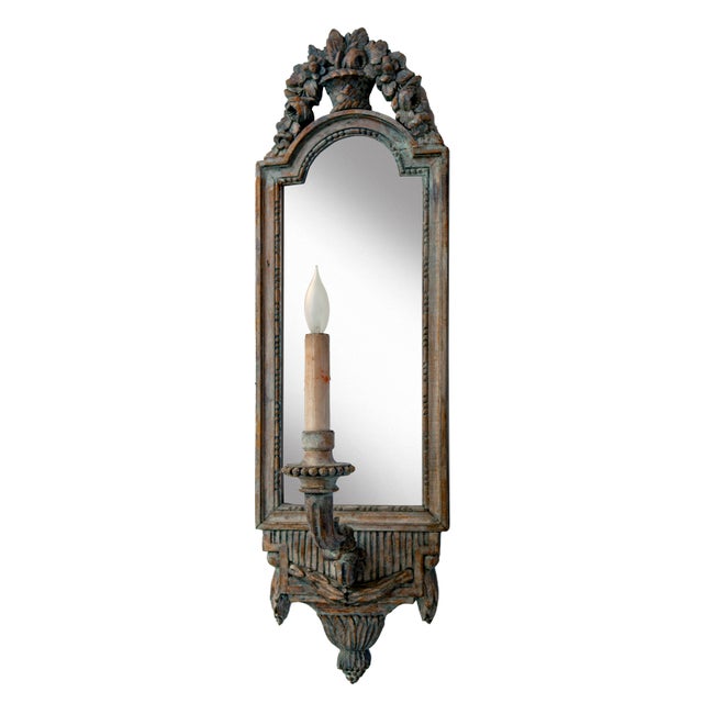 Antique French Mirrored carved Wooden Sconce with a single electrified candle light.