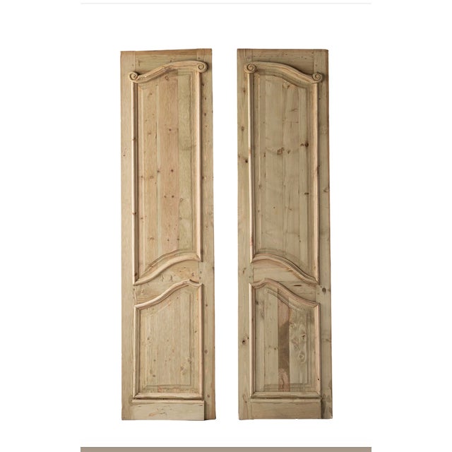 Inspired by the era, of French Provincial is a Tall Pair of gracefully carved door panels. Made of architectural salvage...
