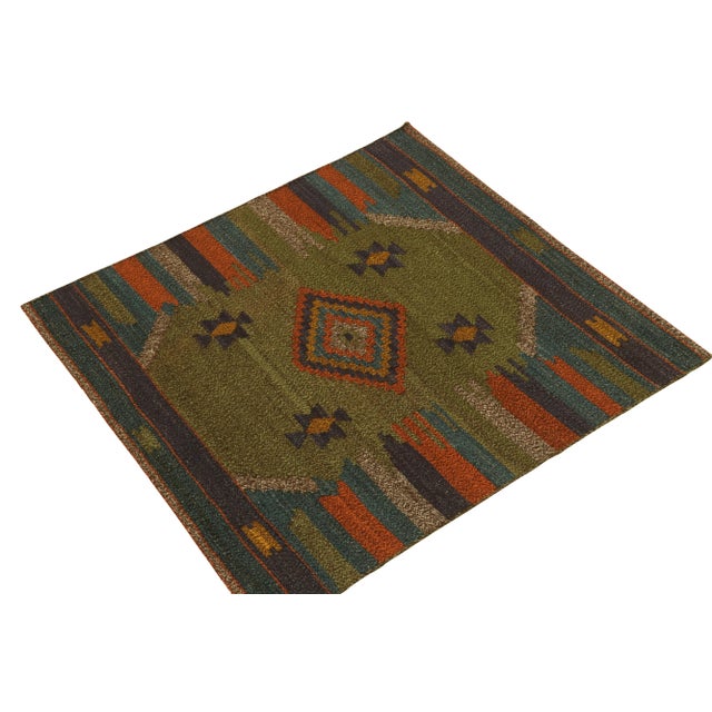 Handwoven in wool circa 1980-1990, from a rare vintage curation of small-sized Kilim rugs joining our tribal classics. A...