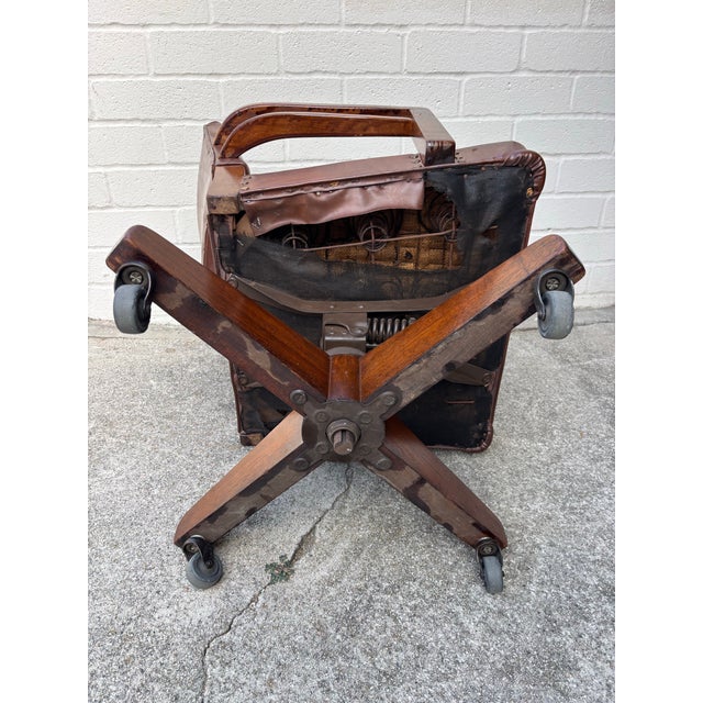 Midcentury Modern 1940s Leather Vintage Swivel Office or Library Desk Chair. Great condition. Wheels all roll smoothly....