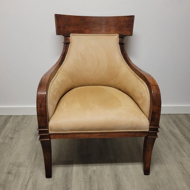 A sculptural chair with a strong architectural profile and inviting proportions that draws on Klismos and gondola forms....