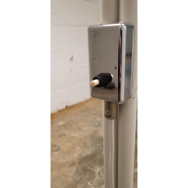 Anders Pehrson Bumling Floor Lamp Materials: Round white painted metal (iron) tubular base & rod. Chrome lid and built-in...