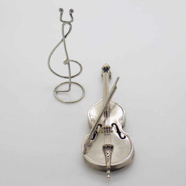 Elegant vintage miniature depicting a violin with bow on stand, handcrafted in Italy between the 1980s and 1990s by the...