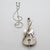Elegant vintage miniature depicting a violin with bow on stand, handcrafted in Italy between the 1980s and 1990s by the...
