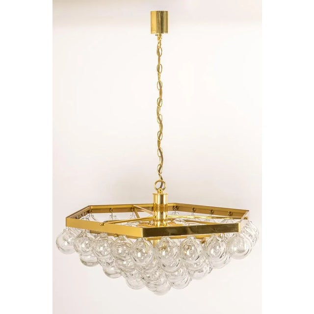 Wonderful onion-shaped. Tulipan glass chandelier. 61 hand-blown glasses suspended on a brass metal frame. Best of design...