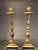 Amazing pair of Mid Century solid brass candlesticks with triangular base and claw feet. The pair give off an...