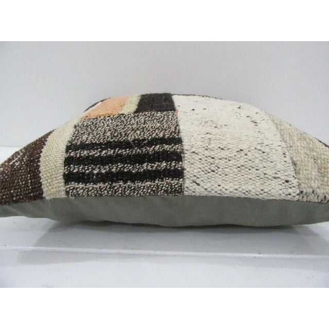 This is a pillow cover made from a vintage kilim rug. The piece was properly washed and ready to use. Pillow inserts not...