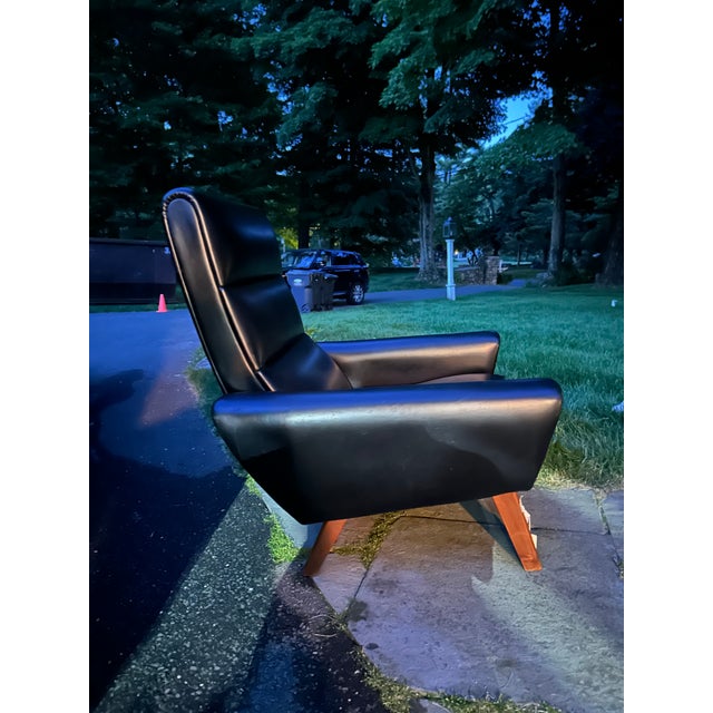 MCM Stylish, comfortable and in great condition. Mid Century Modern, Highback 1960's Black Leatherette Lounge Chair. Teak...