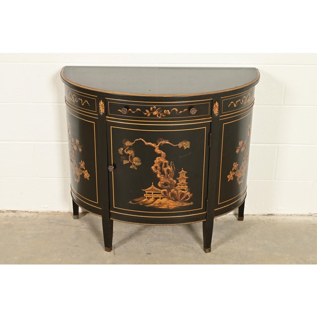 An exceptional Hollywood Regency or French Regency Louis XVI Chinoiserie style demilune bar cabinet or console table By...
