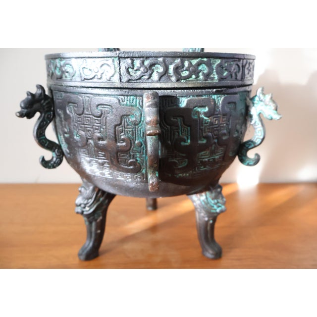 A large and richly detailed vintage ice bucket in the style of James Mont, manufactured by Getz Bros. & Co. of Taiwan,...